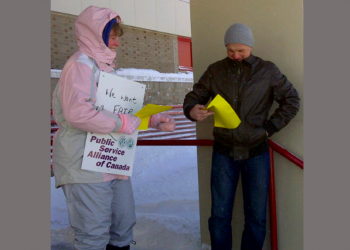 Striking airport workers take to the Hilltop