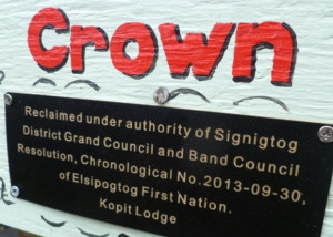 plaque on sign (text)
